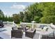 Relax on the expansive deck featuring cushioned furniture with a pool view at 175 Turnberry Ln, Mooresville, NC 28117