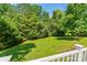 Picturesque backyard featuring lush green grass, mature trees, and ample space for outdoor enjoyment at 176 Sharon Valley Dr, Hickory, NC 28601