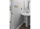 Pedestal sink in bathroom featuring updated lighting and modern fixtures at 176 Sharon Valley Dr, Hickory, NC 28601