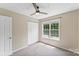 Cozy bedroom with ceiling fan, window with a view, and double door closet at 176 Sharon Valley Dr, Hickory, NC 28601
