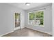 Bright dining area with natural light and a view to a screened-in porch at 176 Sharon Valley Dr, Hickory, NC 28601
