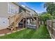 Landscaped backyard with a cozy outdoor seating area and pergola at 1826 Hall Ave, Charlotte, NC 28205