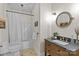 Well-lit bathroom featuring a stylish vanity, toilet, shower with tub, and attractive floor tiles at 1826 Hall Ave, Charlotte, NC 28205