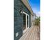 Exterior view of a home's side featuring wood deck, artificial vines and white trim at 1826 Hall Ave, Charlotte, NC 28205