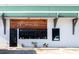 The Bohemian: A Wine Bar exterior with a rustic wooden sign and inviting entrance plants at 1826 Hall Ave, Charlotte, NC 28205