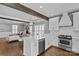 Bright kitchen with stainless appliances, farmhouse sink, island, and eat in dining, which opens up to the living room at 1826 Hall Ave, Charlotte, NC 28205
