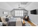 Cozy main bedroom with light gray walls, hardwood floors, and large window with plantation shutters at 1826 Hall Ave, Charlotte, NC 28205
