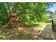A delightful backyard featuring a wooden playset and lush green space at 2131 Lee St, Gastonia, NC 28054