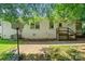 Back of home features basketball hoop and brick patio at 2131 Lee St, Gastonia, NC 28054