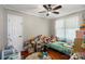 Bedroom with hardwood floors, ceiling fan, and natural light at 2131 Lee St, Gastonia, NC 28054