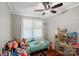 Bedroom with hardwood floors, ceiling fan, and natural light at 2131 Lee St, Gastonia, NC 28054