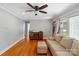 Bright living room featuring wood floors, a ceiling fan, and comfortable seating at 2131 Lee St, Gastonia, NC 28054