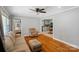 Inviting living room with hardwood floors, neutral decor, and views into the kitchen at 2131 Lee St, Gastonia, NC 28054