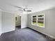 Bright bedroom with large windows, neutral walls, and a ceiling fan at 2136 W 6Th Ave, Gastonia, NC 28052
