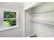 Clean and organized closet space with shelving, complemented by a bright window at 2136 W 6Th Ave, Gastonia, NC 28052
