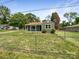 Charming home featuring a well-kept lawn and a chain-linked fence at 2136 W 6Th Ave, Gastonia, NC 28052