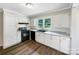 Well-lit kitchen featuring sleek countertops, white cabinets, and modern appliances at 2136 W 6Th Ave, Gastonia, NC 28052