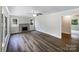 Bright living room featuring hardwood floors, a decorative fireplace, and abundant natural light at 2136 W 6Th Ave, Gastonia, NC 28052