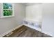 Bright mud room with storage cubbies, wood-look flooring, and a window providing natural light at 2136 W 6Th Ave, Gastonia, NC 28052