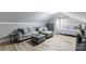 Comfortable bonus room featuring a bed, a couch, hardwood floor, and stylish decor at 22 Honeysuckle Ln, Clover, SC 29710