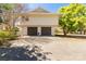 Spacious home with a convenient two-car garage and ample driveway space, set amidst lush greenery at 22 Honeysuckle Ln, Clover, SC 29710