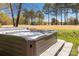 Inviting hot tub nestled in a serene outdoor setting on a golf course, perfect for relaxation and enjoying the peaceful surroundings at 22 Honeysuckle Ln, Clover, SC 29710