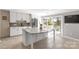 Modern kitchen with white cabinets, stainless steel appliances, and a large island with bar seating at 22 Honeysuckle Ln, Clover, SC 29710