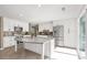 Bright kitchen with white cabinets, stainless steel appliances, and a large island with a quartz countertop at 22 Honeysuckle Ln, Clover, SC 29710