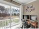 Bright home office space with modern desk, two monitors, and a view of the yard at 22 Honeysuckle Ln, Clover, SC 29710