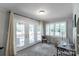 Bright room with french doors leading to the yard, window with blinds, neutral paint, and desk at 22 Honeysuckle Ln, Clover, SC 29710