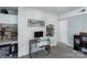 This home office features a painted brick wall and custom shelving above a desk and storage, ideal for a dedicated workspace at 22 Honeysuckle Ln, Clover, SC 29710