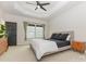 Well-lit bedroom with tray ceiling, neutral walls, and a large window offering ample natural light at 2203 Autumn Olive Ln, Stallings, NC 28104