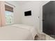 Clean bedroom with carpet and a window with woven shades that provides great light at 2203 Autumn Olive Ln, Stallings, NC 28104
