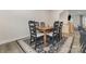 Dining area featuring wooden table, six chairs, and view of the kitchen at 2203 Autumn Olive Ln, Stallings, NC 28104