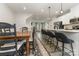 Spacious open floorplan view of the dining room, kitchen with seating, and the living room at 2203 Autumn Olive Ln, Stallings, NC 28104