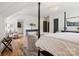 Elegant primary bedroom featuring a four poster bed, with lots of space and natural light at 2215 Cortelyou Rd, Charlotte, NC 28211