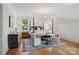 Bright bedroom with natural light featuring a four poster bed and stylish armchairs with a table between at 2215 Cortelyou Rd, Charlotte, NC 28211