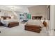 Spacious bedroom featuring two beds, vintage trunks, and ample natural light at 2215 Cortelyou Rd, Charlotte, NC 28211