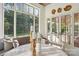 Breakfast nook with round table, bench seating and large windows offering natural sunlight at 2215 Cortelyou Rd, Charlotte, NC 28211