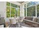 Breakfast nook with bench seating and large windows offering natural sunlight at 2215 Cortelyou Rd, Charlotte, NC 28211