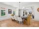 Dining area with modern table, stylish chairs and natural light at 2215 Cortelyou Rd, Charlotte, NC 28211