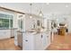 Bright kitchen featuring an island, granite countertops, and stainless steel appliances at 2215 Cortelyou Rd, Charlotte, NC 28211