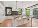 Bright kitchen with an island, granite countertops, and stainless steel appliances at 2215 Cortelyou Rd, Charlotte, NC 28211