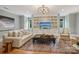Inviting living room featuring built-in shelving, plush seating, and modern lighting fixtures at 2215 Cortelyou Rd, Charlotte, NC 28211