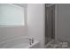 Bathroom featuring shower and tub at 250 Winford Rd, Troutman, NC 28166