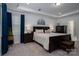 Bedroom features natural light and an elegant dark wood bedroom set at 250 Winford Rd, Troutman, NC 28166