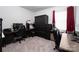 Bedroom featuring office setup with carpet flooring and a window providing natural light at 250 Winford Rd, Troutman, NC 28166