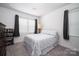 Bedroom featuring carpet flooring, curtains, and natural light at 250 Winford Rd, Troutman, NC 28166