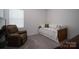 Small bedroom with a comfortable chair, twin bed and a small window at 250 Winford Rd, Troutman, NC 28166
