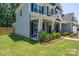 Charming home exterior with manicured lawn, stone accents, covered porch, and tasteful landscaping at 250 Winford Rd, Troutman, NC 28166